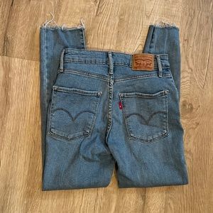 Levi’s 721 High Rise skinny distressed jeans. Raw hem. Size 24 x 30